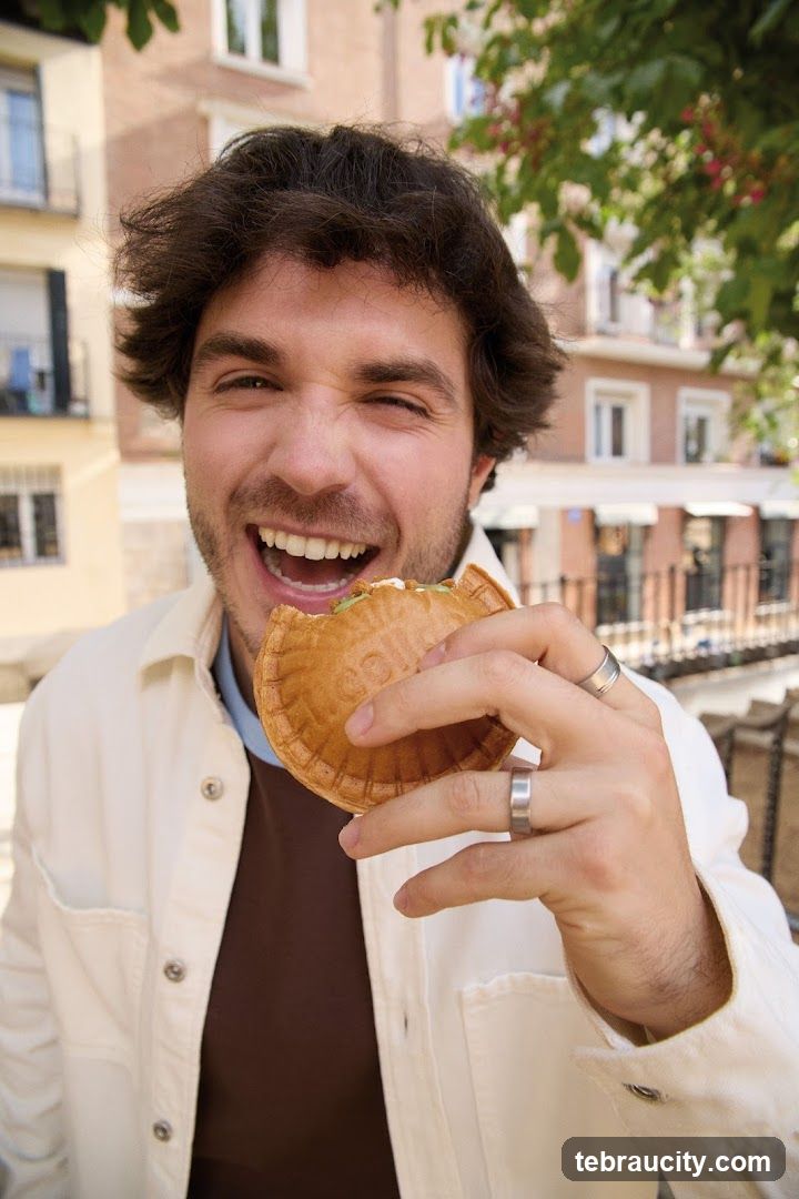 Man eating a pastry