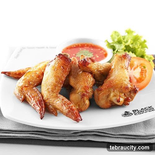 Chicken Wings with Sauce and Garnish