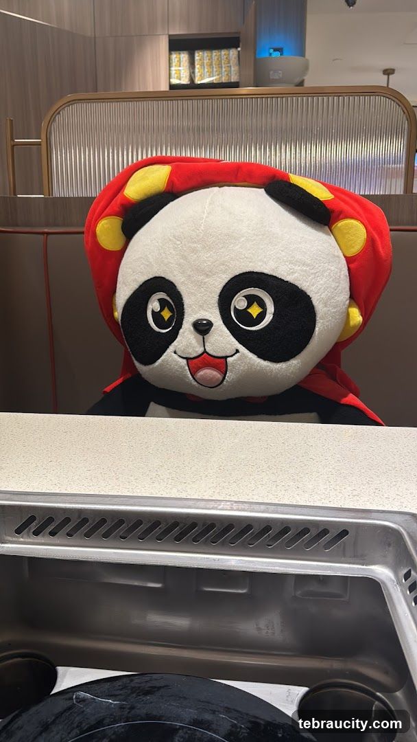 Panda Plush Toy in Restaurant Booth