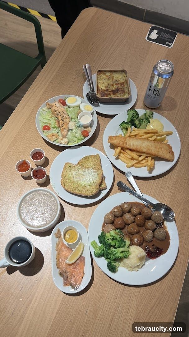 Table with various dishes and a drink