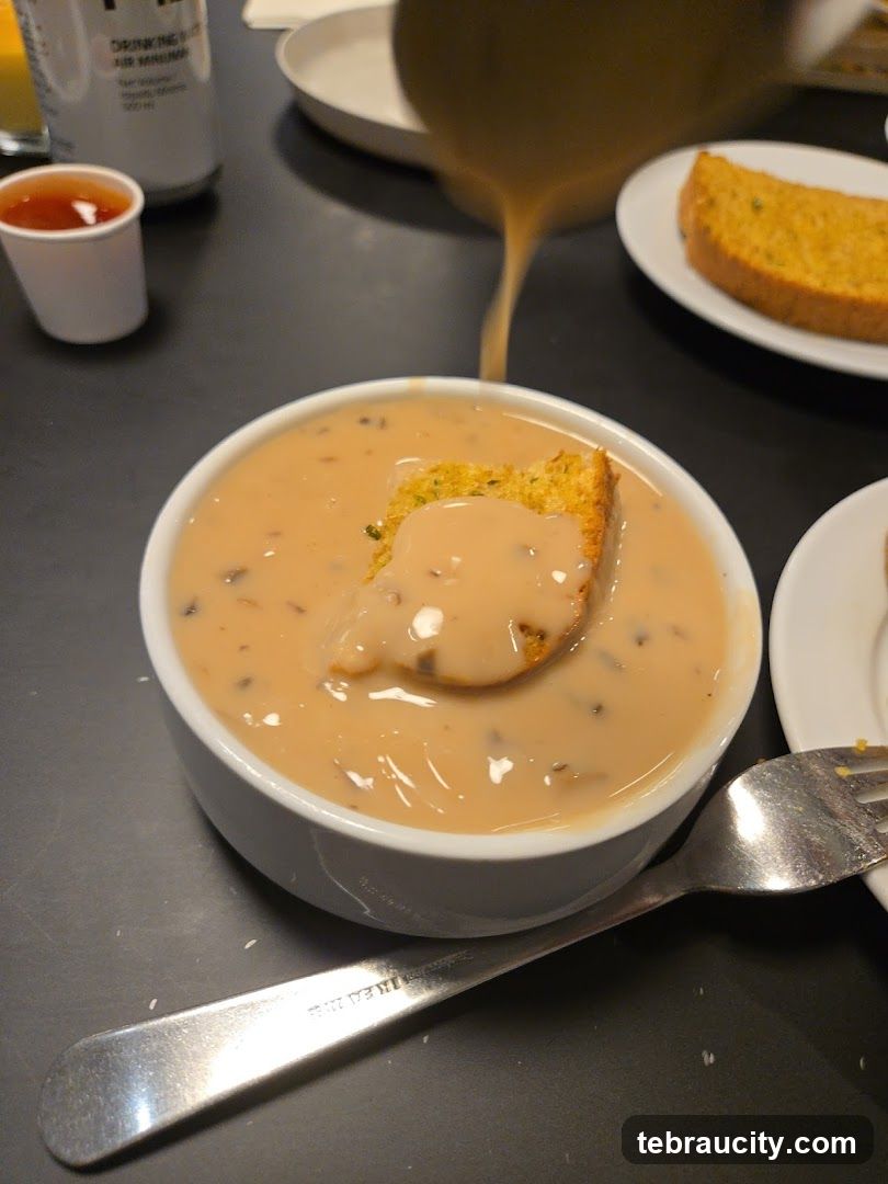 Soup being poured into a bowl