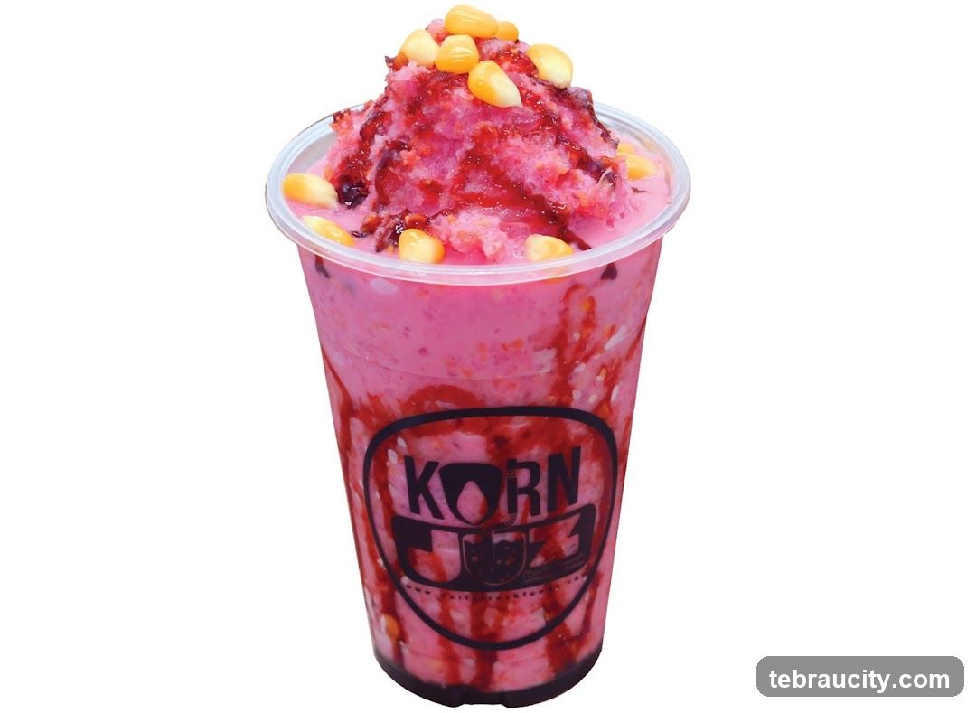 Pink shaved ice drink with corn and syrup
