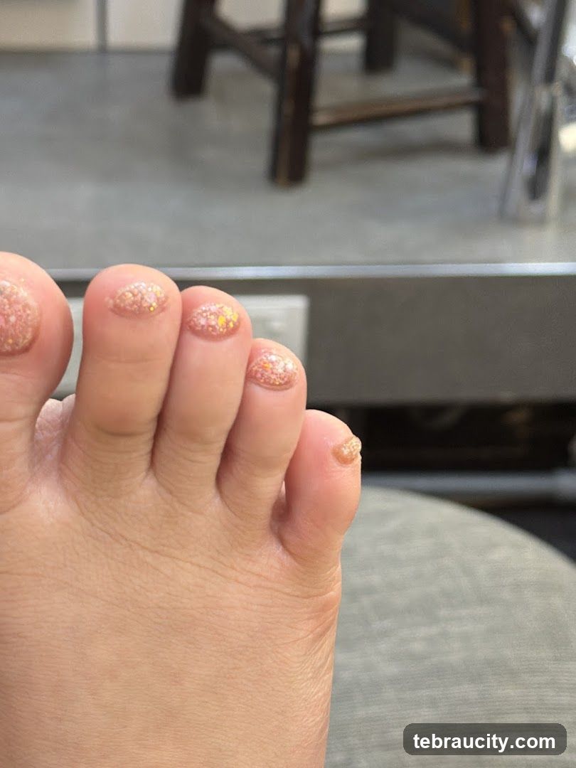 Close-up of a foot with glitter nail polish