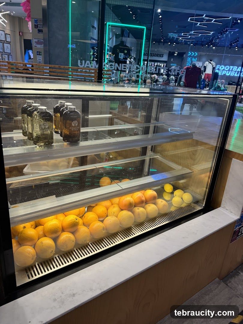Display Case with Oranges and Bottles