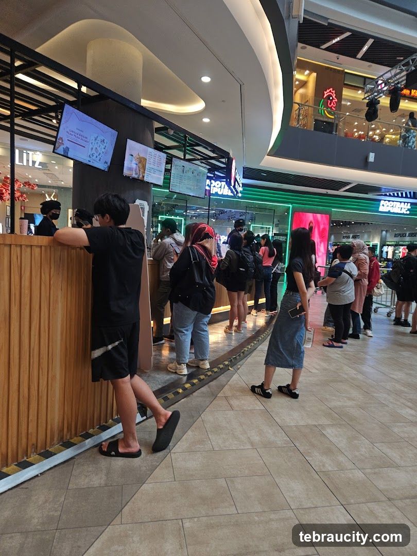 People queuing at a food stall