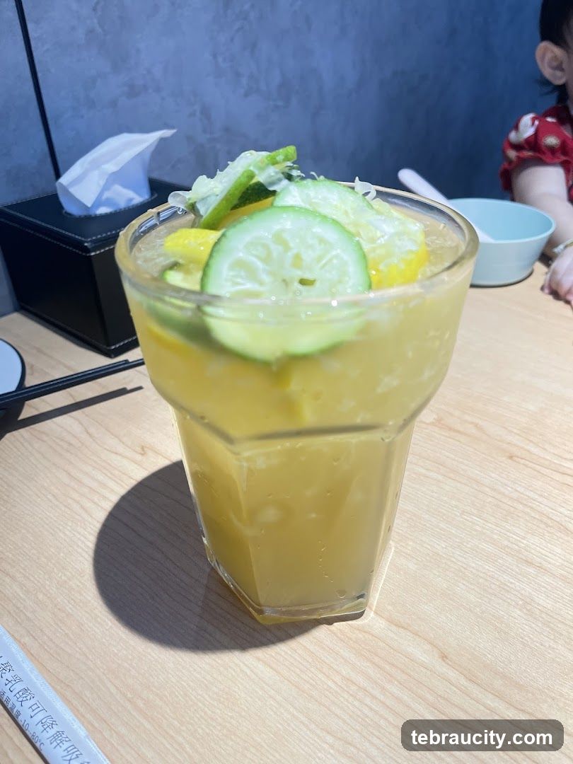Yellow Drink with Citrus Garnish