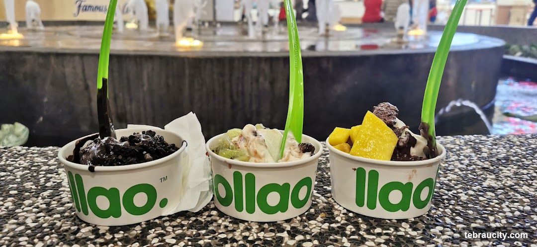 Three cups of frozen yogurt with toppings