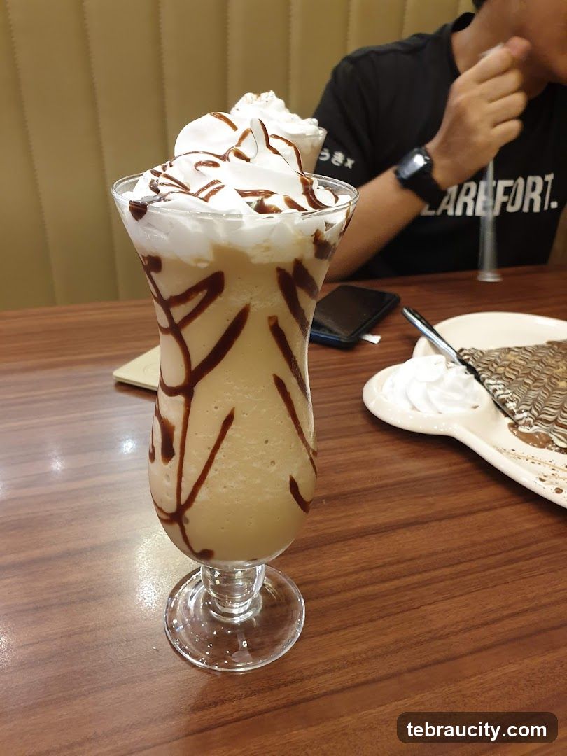 Iced Coffee with Whipped Cream and Chocolate Drizzle