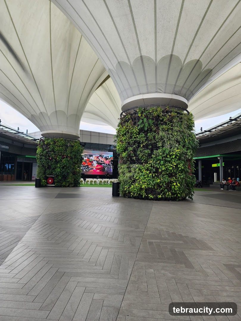 Outdoor plaza with vertical gardens and large screens