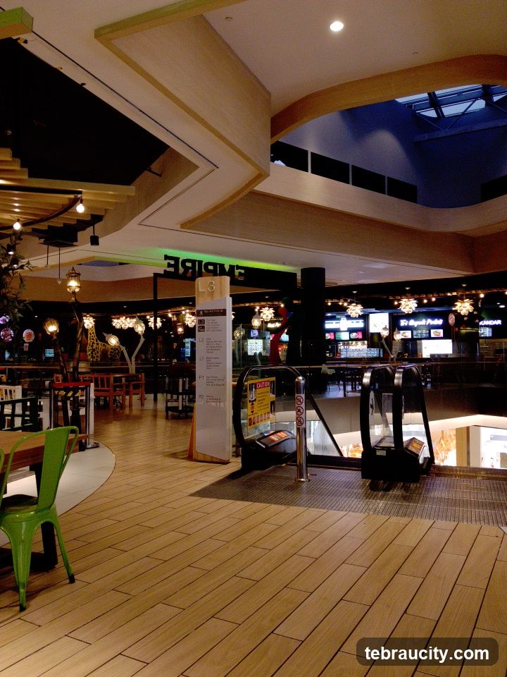 Mall Interior with Escalators and Seating Areas