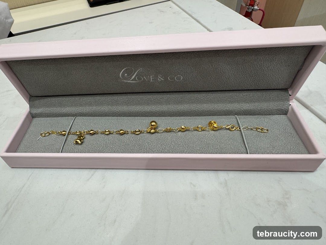 Gold bracelet in a pink box