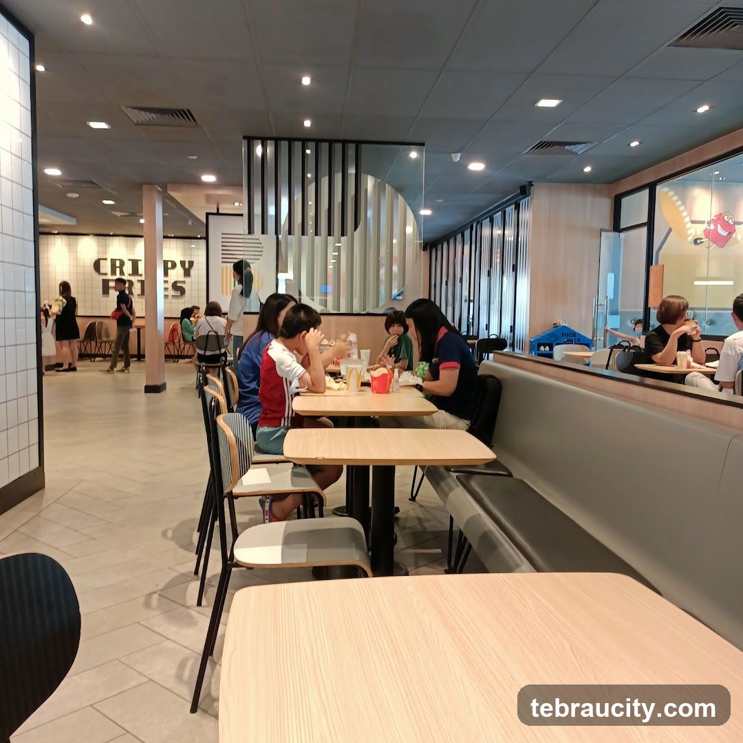 People eating at tables in a fast-food restaurant
