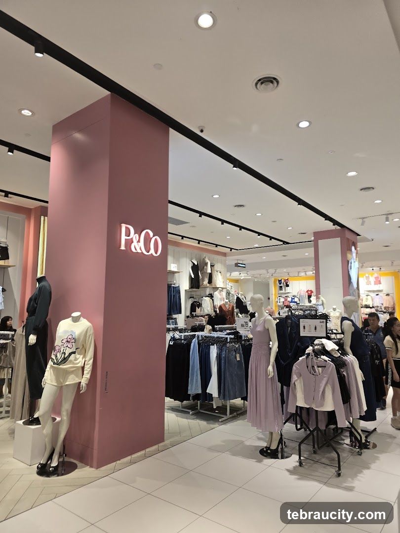 Clothing store interior with mannequins and apparel