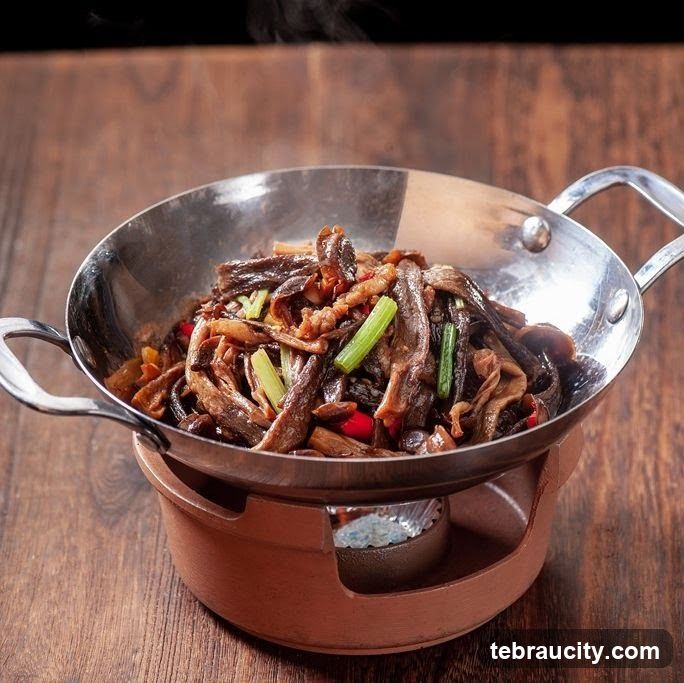 Stir-fried dish in a metal bowl