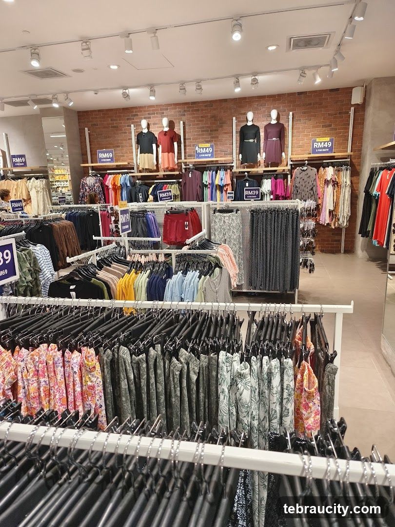 Clothing store interior with mannequins and racks of clothes