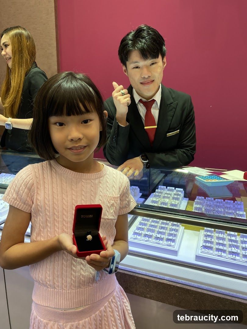 Girl Holding a Ring Box in a Jewelry Store
