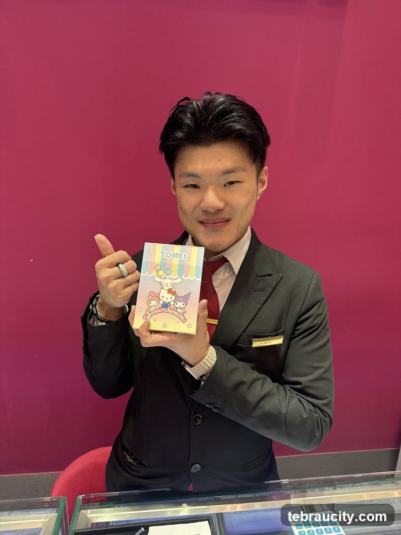 Man holding Sanrio characters notebook