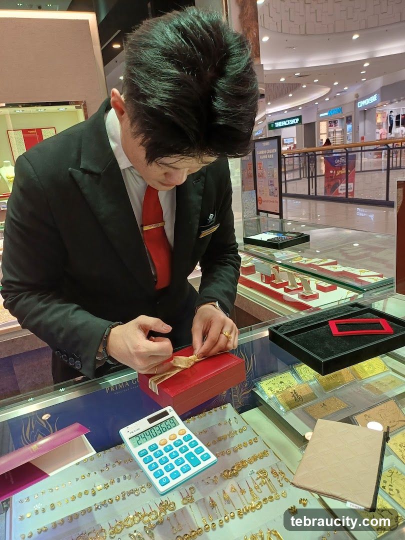 Jewelry Store Employee Wrapping a Gift