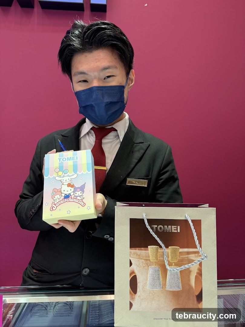 Jewelry store employee with Sanrio-themed gift box and earrings