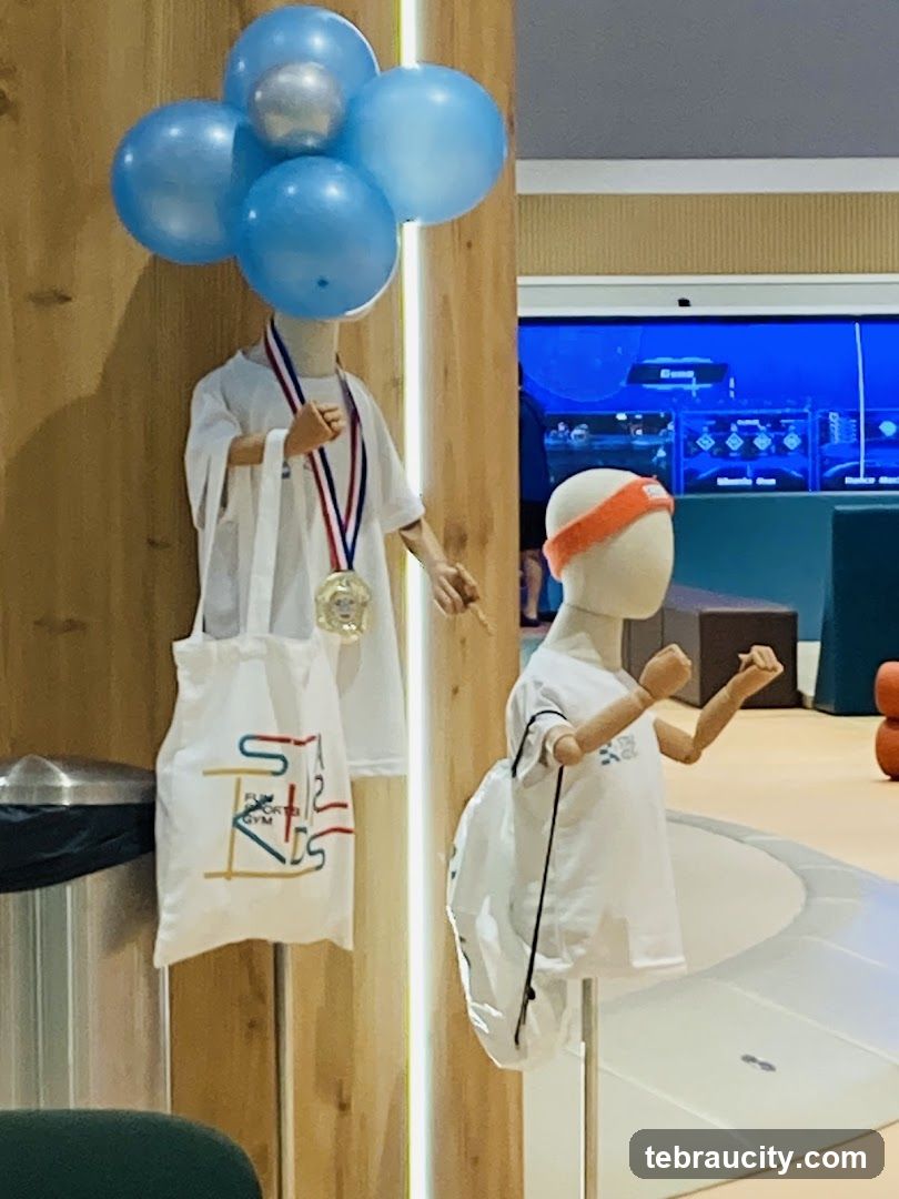 Mannequins with sports attire and medals