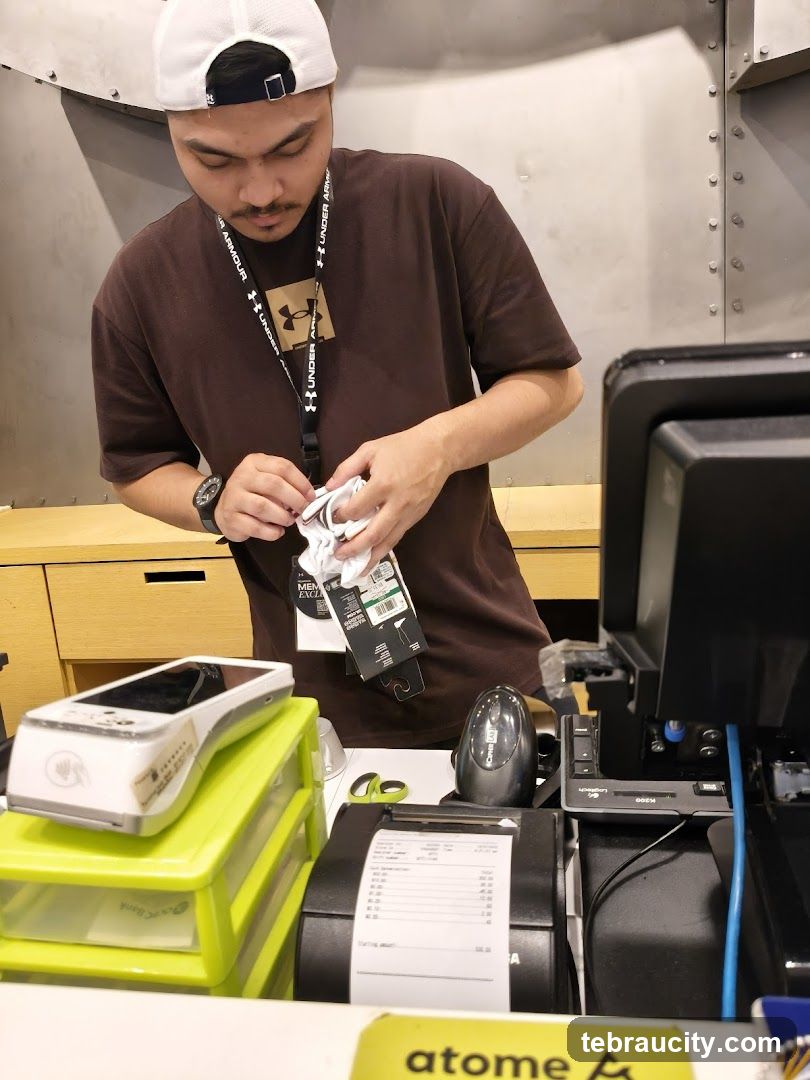 Cashier preparing items at checkout