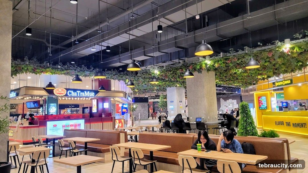 Food court with seating and various food stalls