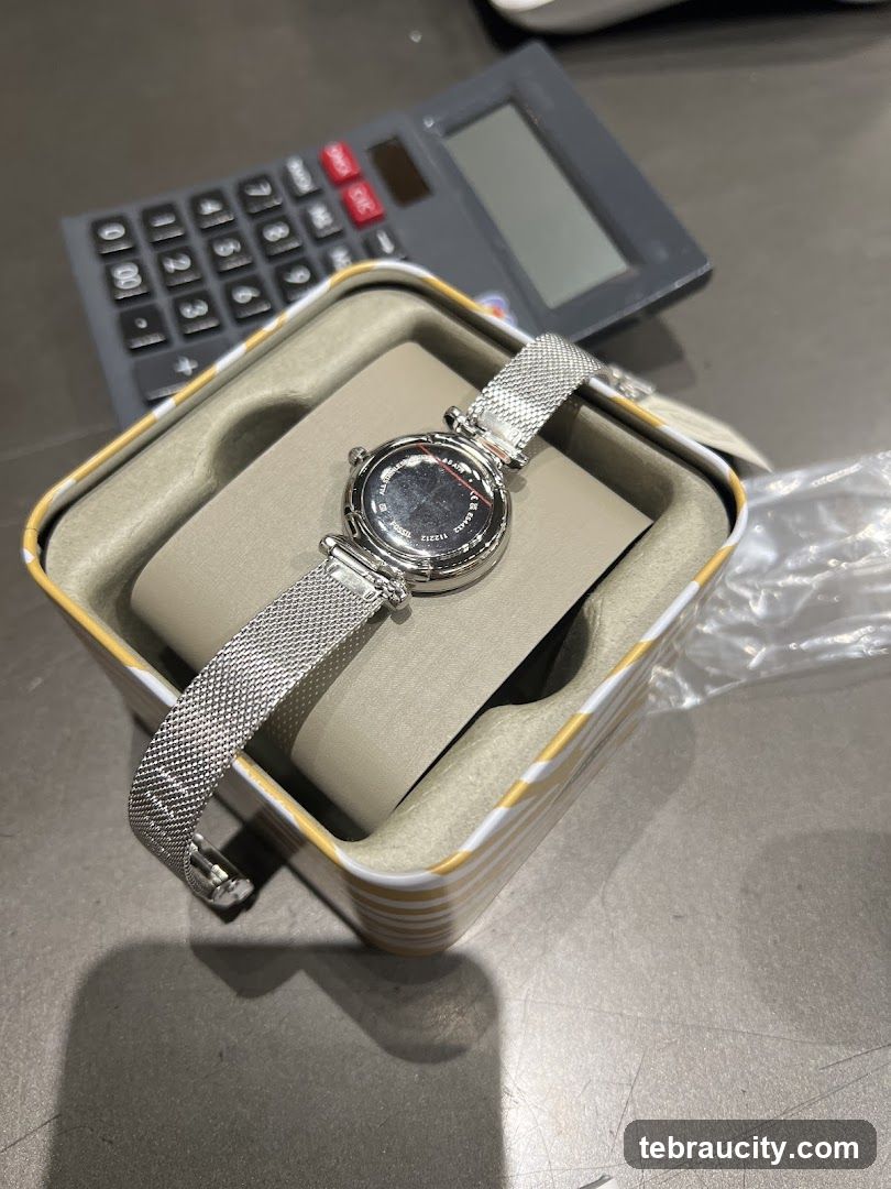 Watch in a box with a calculator