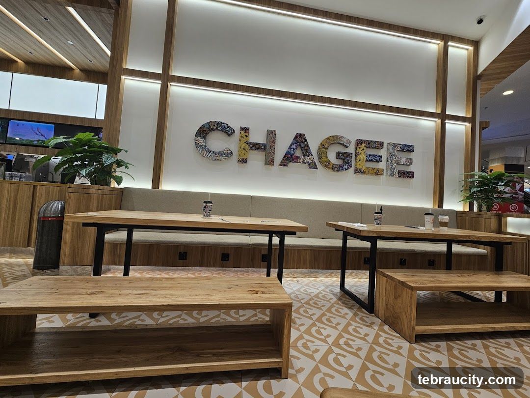 Modern cafe interior with large decorative letters spelling "CHAGEE"