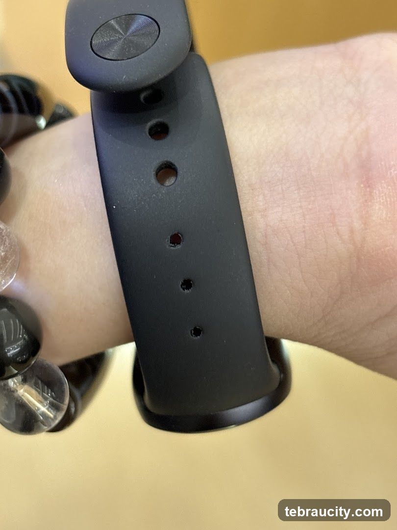 Close-up of a black smart band on a wrist