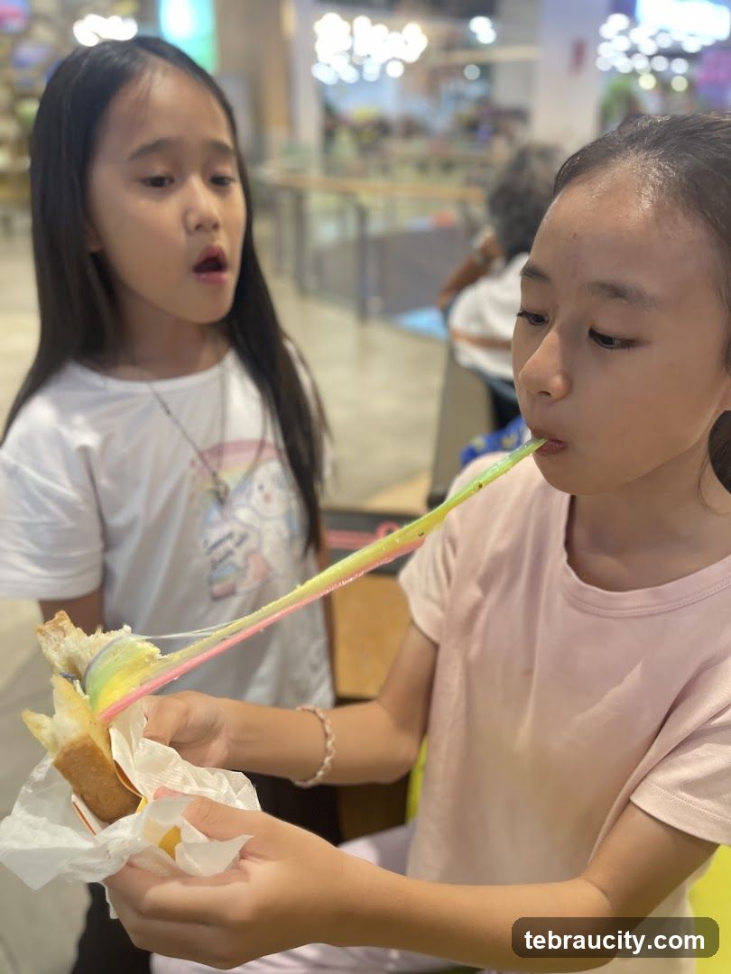 Girls eating rainbow cheese toast