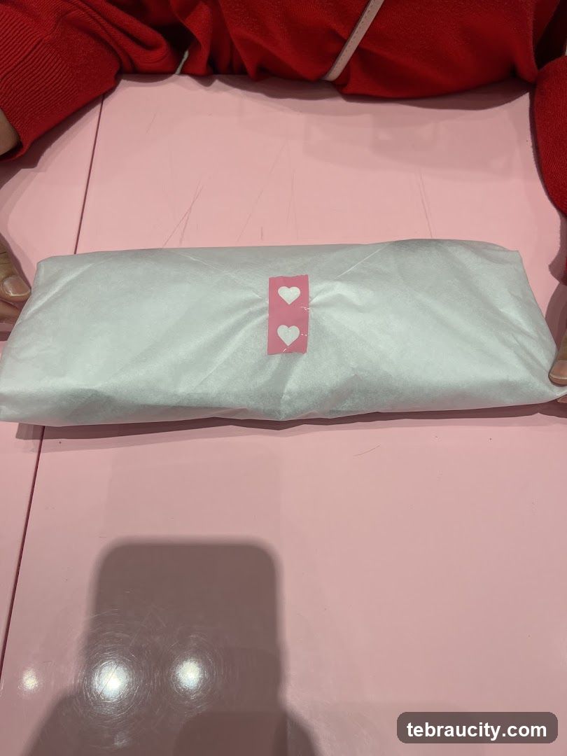 Wrapped item with heart sticker