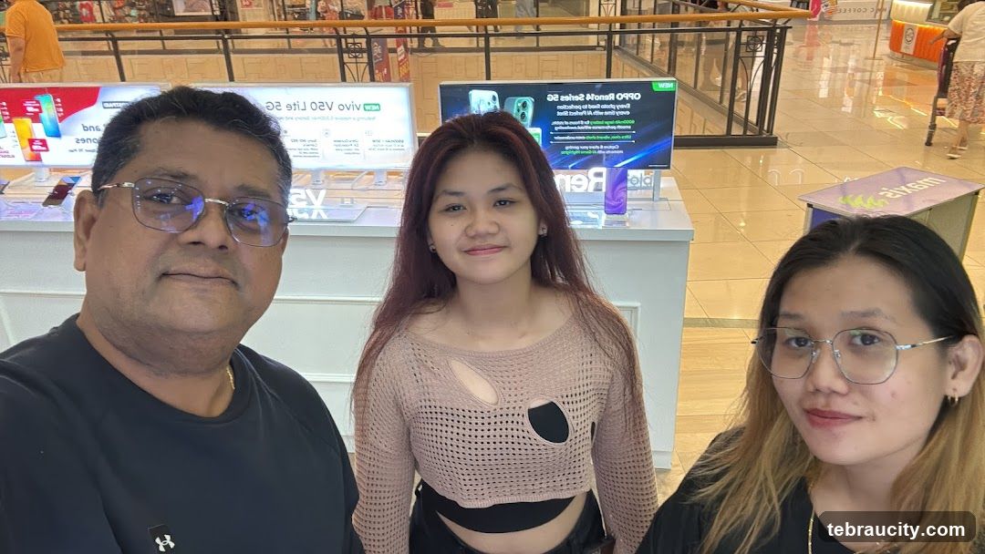 Three people posing for a photo in a store