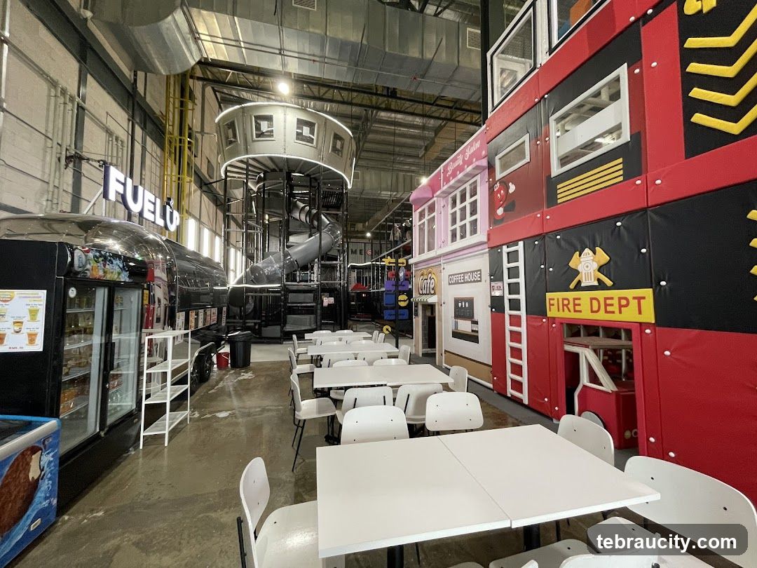 Indoor Play Area with Themed Structures and Seating
