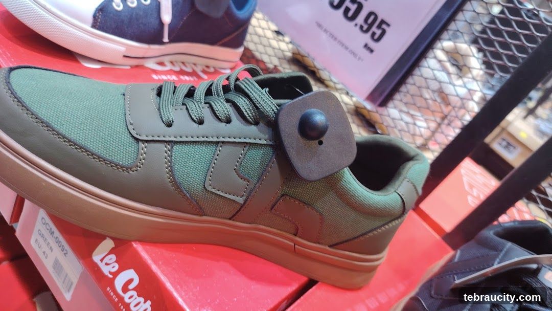 Green Sneakers with Security Tag