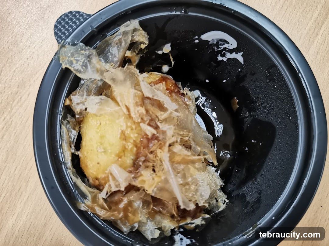 Takoyaki in a black bowl