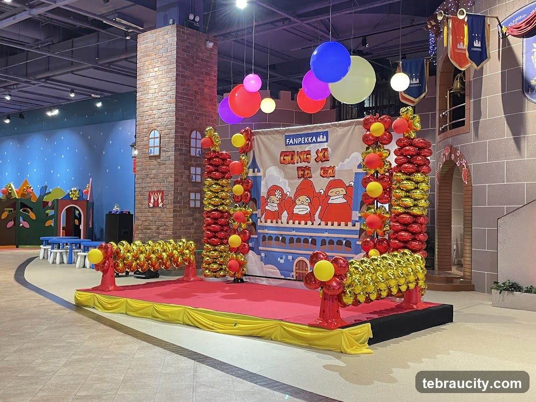 Stage decorated with balloons and banners