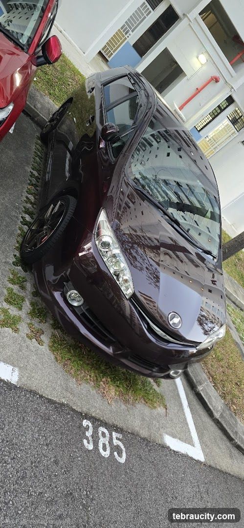 Dark Red Car Parked in Lot