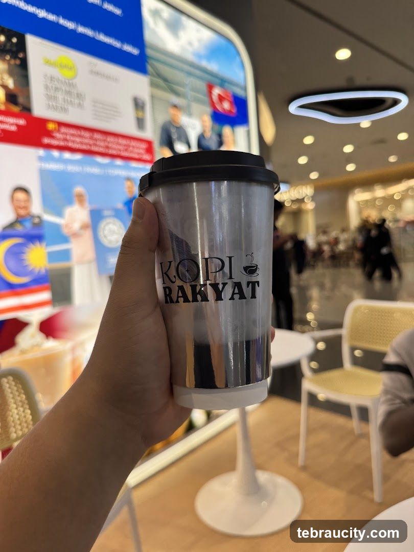 Person holding a coffee cup