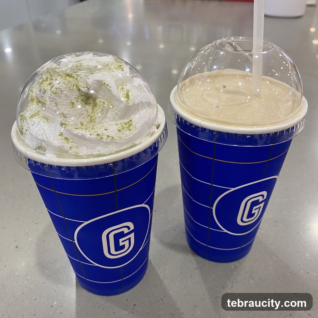 Two beverages in branded cups