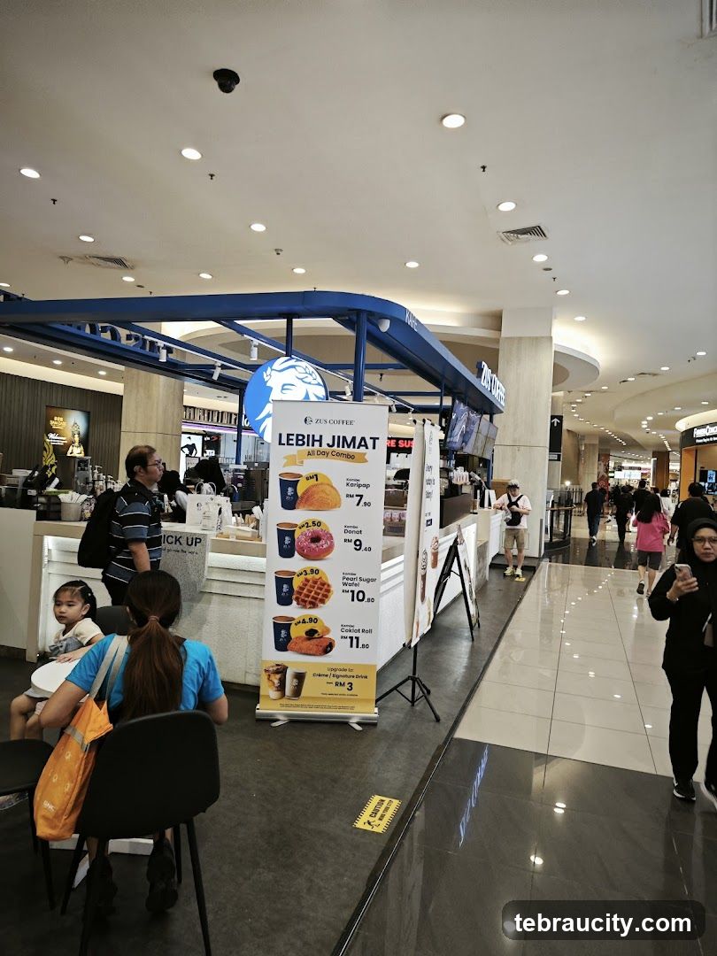 ZUS Coffee counter with promotional banner