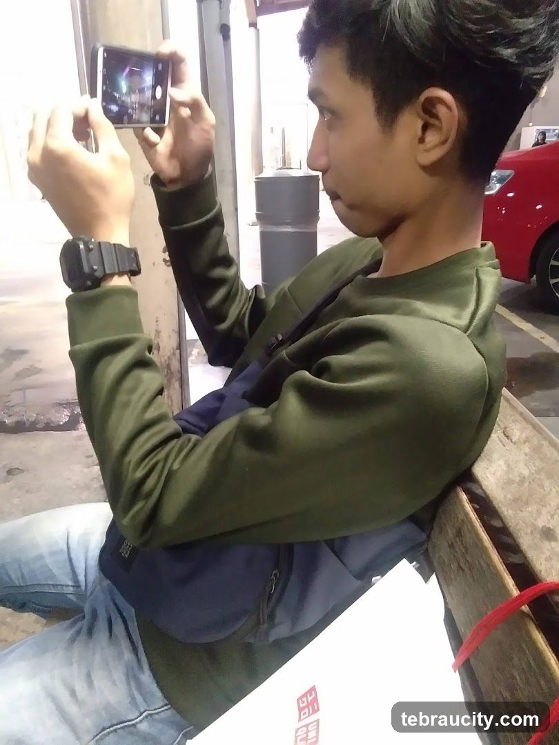 Man taking a photo with his phone