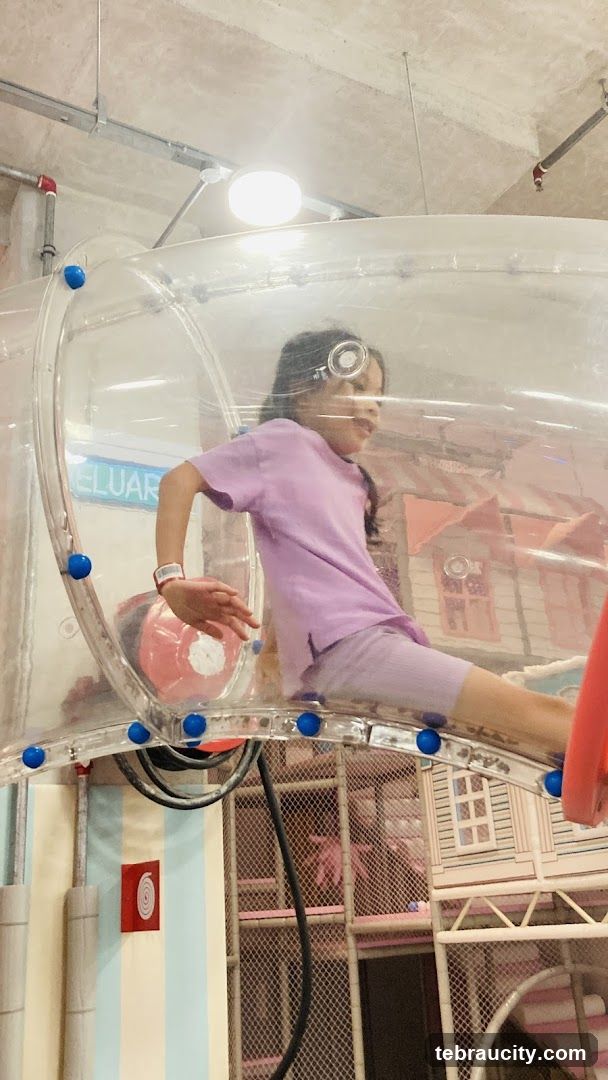 Child in indoor play structure