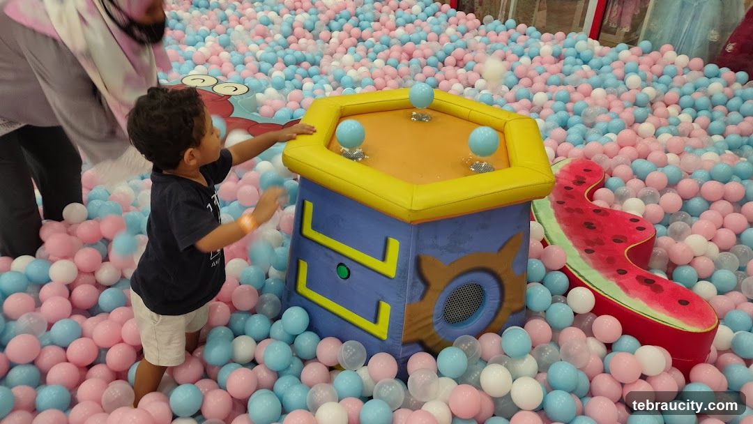 Child playing in ball pit