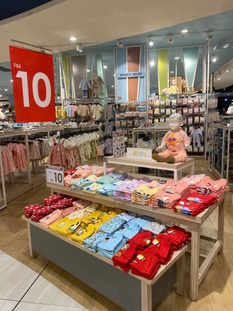 Babies' wear section with RM10 promotional pricing on infant clothing