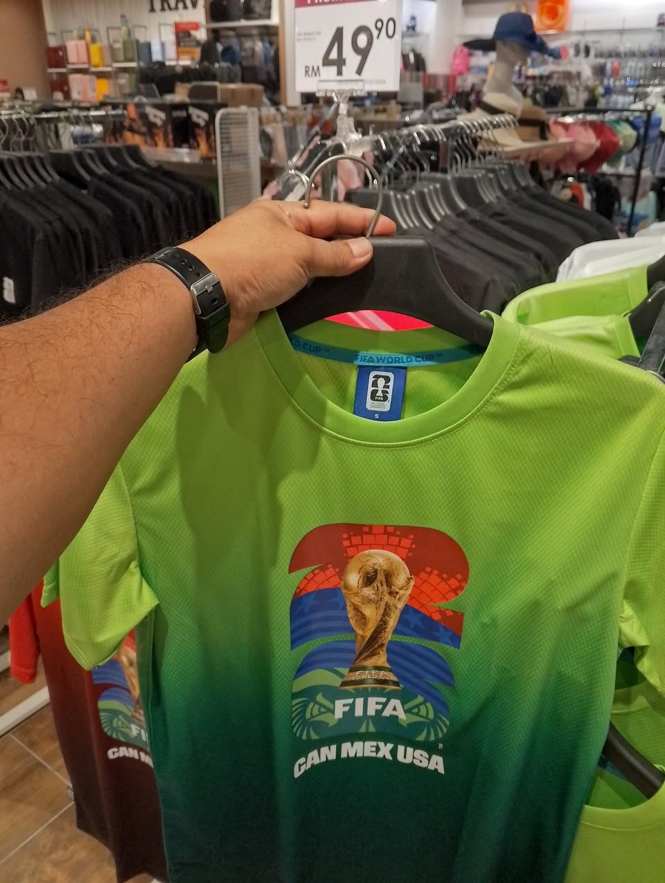 Maxworld Clothing FIFA World Cup 2026 red T-shirt with trophy design priced at RM49.90
