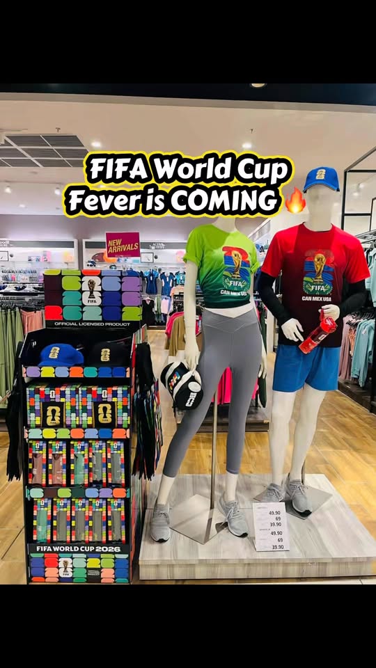 PUMA FIFA World Cup 2026 mannequin display with T-shirts, caps, socks, and water bottles priced from RM39.90 to RM69.90