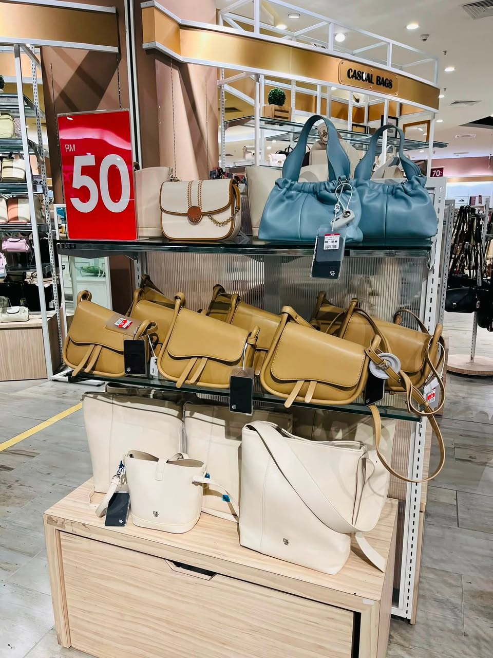 Casual bags on display shelves