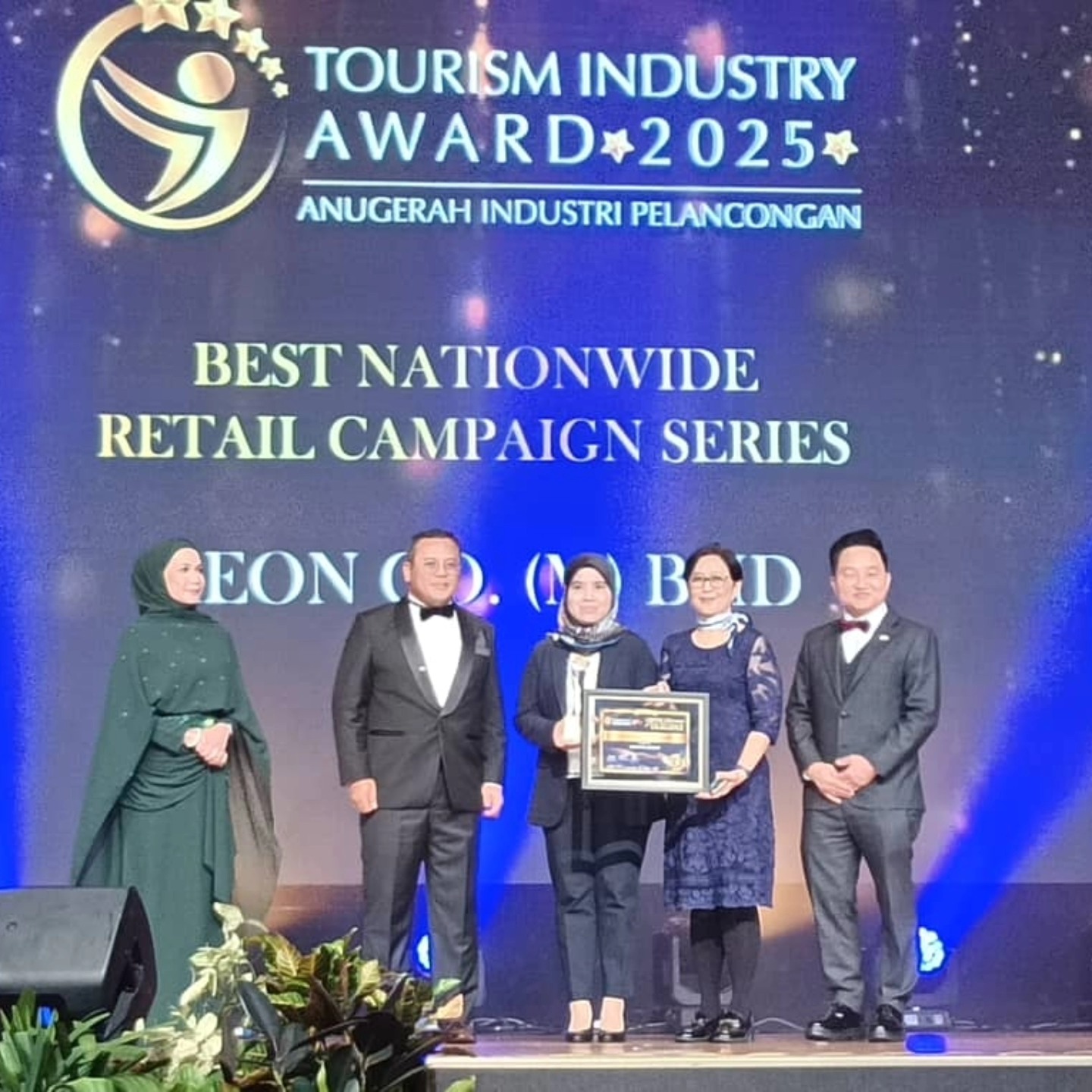 AEON representatives at the Tourism Industry Award ceremony celebrating their win