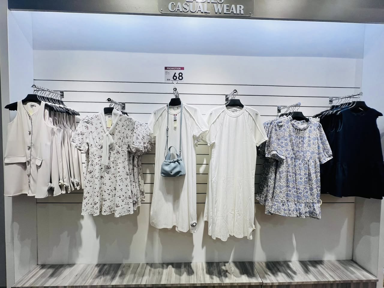 Clothing rack with a promotional banner
