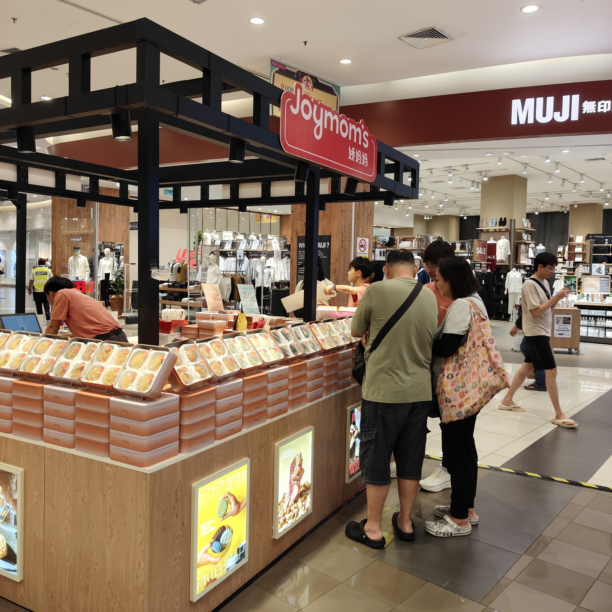 An inviting display of various Jiao Mama mooncake gift boxes and individual mooncakes.